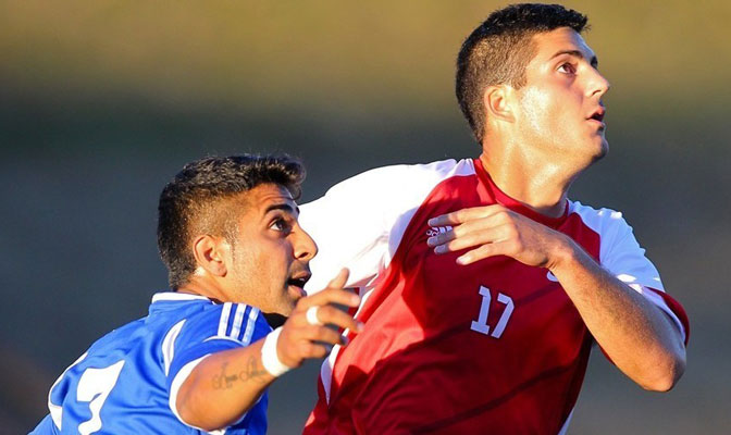 SFU senior Carlo Basso (right) pushed his team to the Division II West Region Finals with a golden goal in double overtime.